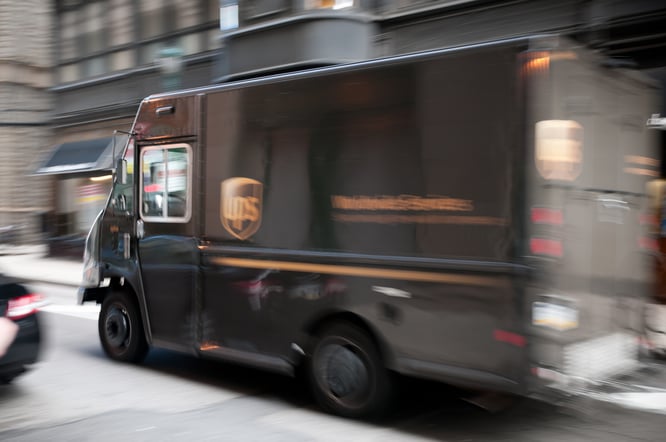 UPS truck in motion. UPS trucks use sensors to gather data to optimize routes.