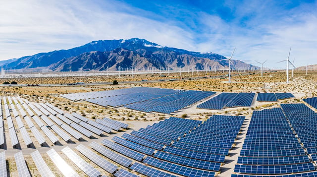 Solar Panels in the Sun Powering Windmills