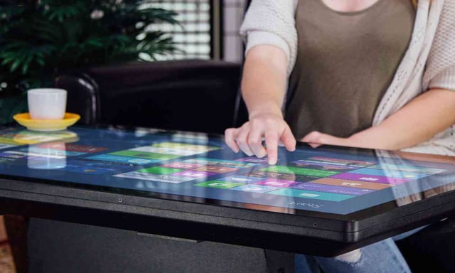 Duet Multitouch Smart Coffee Table with a large touchscreen.