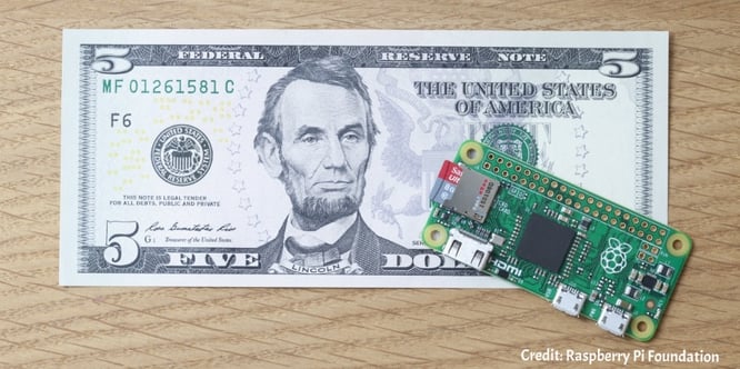 Raspberry Pi Zero module, priced at five dollars, placed next to a five dollar bill.