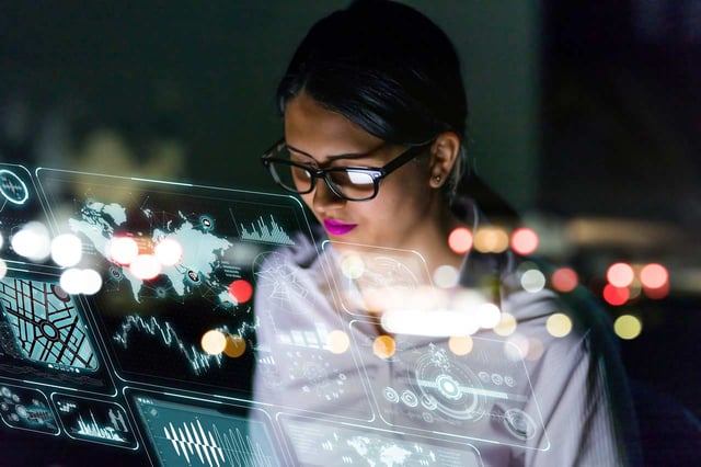 woman-engineer-looking-at-various-information-in-screen-of-futuristic-interface