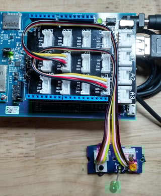 Setup for Intel Edison IO in Johnny-Five with button attached to GPIO pin 4 and LED to GPIO 6.
