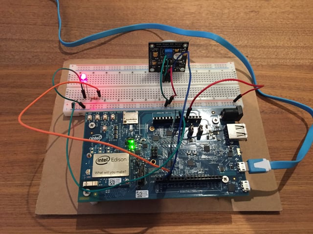 Intel Edison hardware hooked up to a breadboard with a large motion detecting LED light.