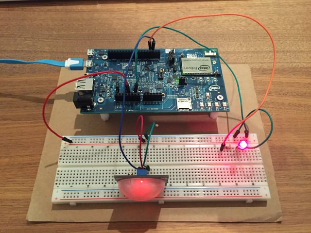 Intel Edison hardware hooked up to a breadboard with a large LED light.